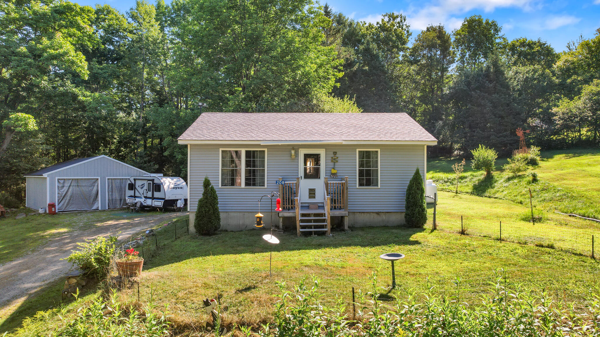 208 Upper Dedham Road Dedham, ME 04429 - Photo 25 of 56 Front view with garage