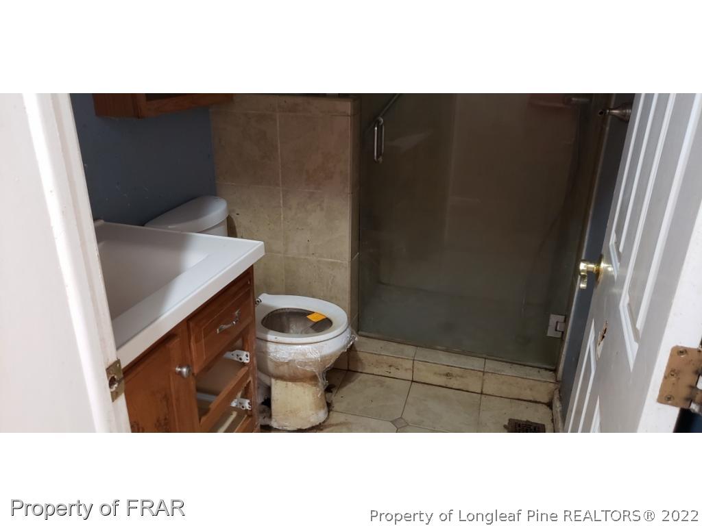 272 Town Branch Road Vass, NC 28394 - Photo 12 of 20 a bathroom with a toilet and a shower