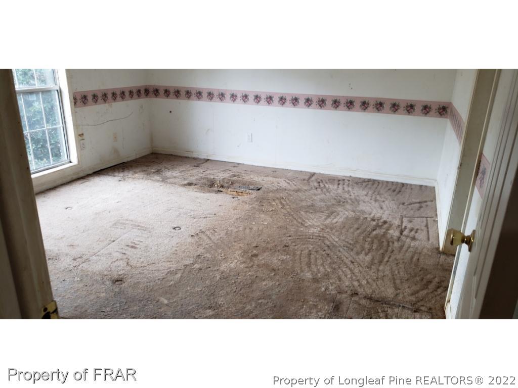 272 Town Branch Road Vass, NC 28394 - Photo 13 of 20 a view of an empty room