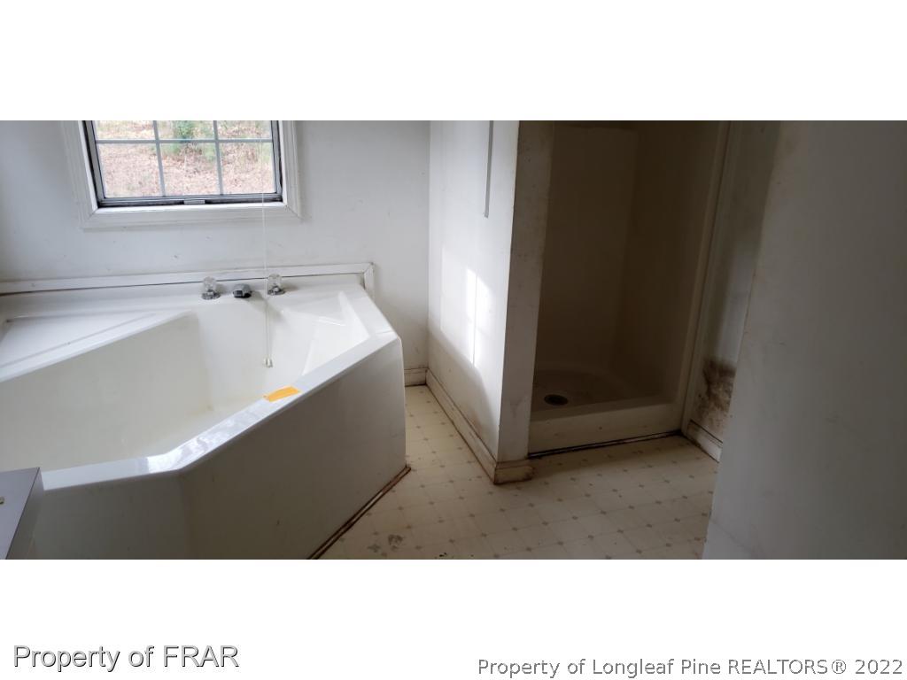 272 Town Branch Road Vass, NC 28394 - Photo 14 of 20 a bathroom with a sink and a mirror