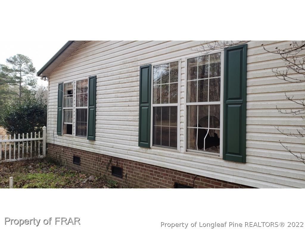 272 Town Branch Road Vass, NC 28394 - Photo 3 of 20 a view of a house with a window