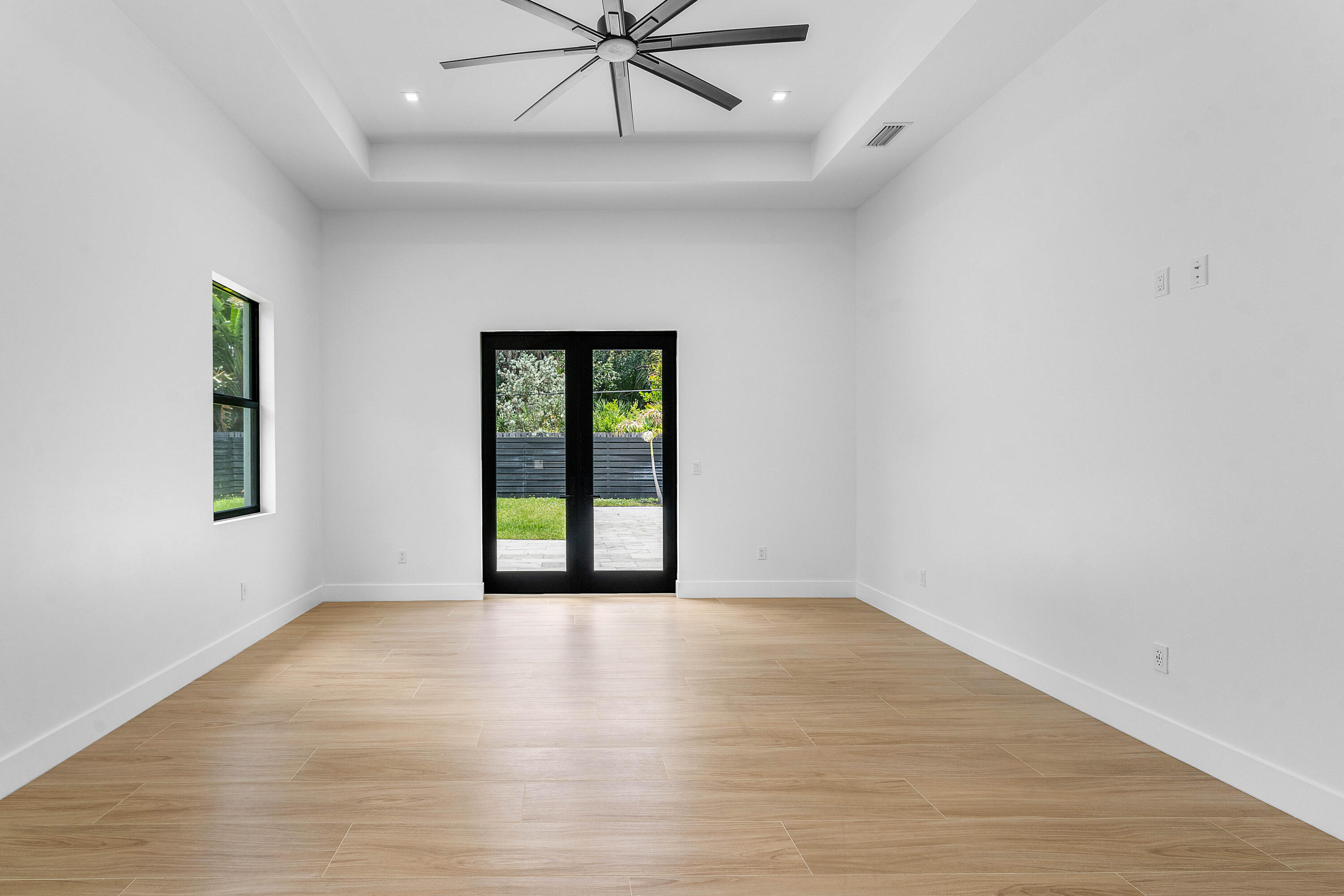 5701 Old Orange Road Jupiter, FL 33458 - Photo 21 of 46 wooden floor in an empty room with a window