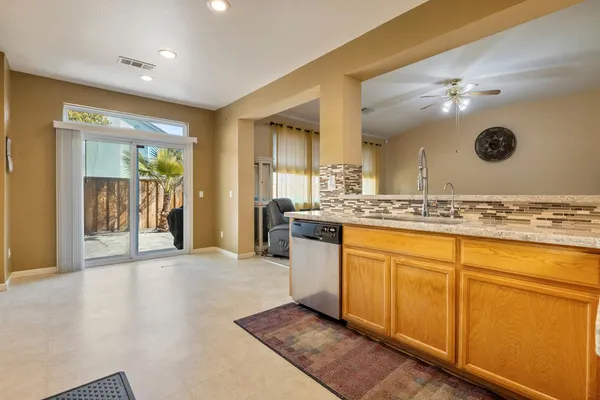 a spacious bathroom with a double vanity sink and a mirror