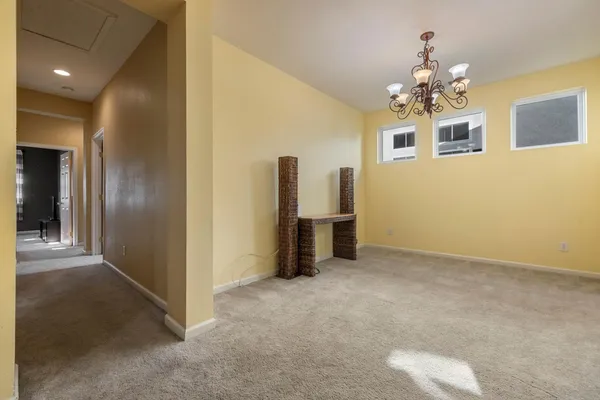 a view of a hallway with wooden shelves