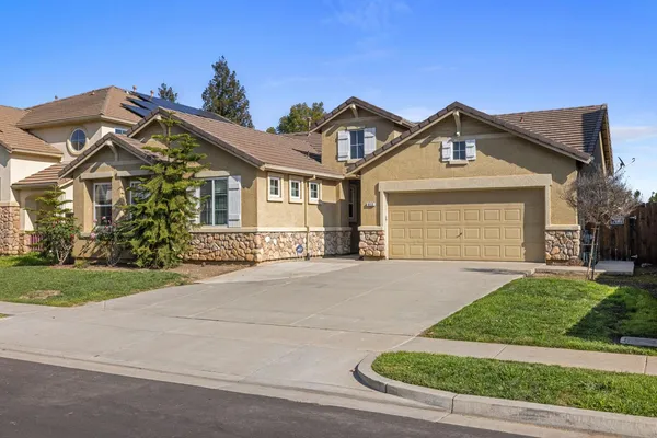 front view of a house with a yard