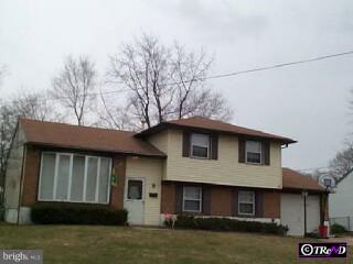a front view of a house with garage