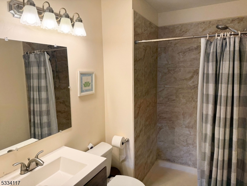 3206 French Drive Bridgewater, NJ 08807 - Photo 12 of 18 a bathroom with a sink and mirror