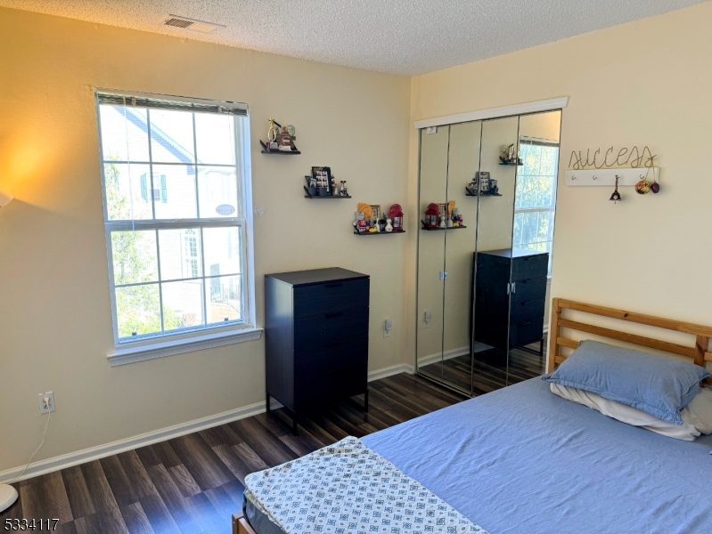 3206 French Drive Bridgewater, NJ 08807 - Photo 14 of 18 a bedroom with a bed and wooden floor