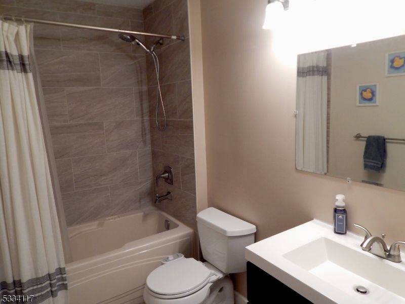 3206 French Drive Bridgewater, NJ 08807 - Photo 15 of 18 a bathroom with a sink toilet and shower