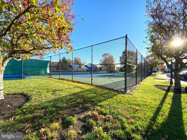 a view of yard with swimming pool and sitting area