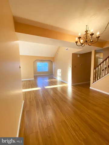 a view of a living room a room with wooden floor