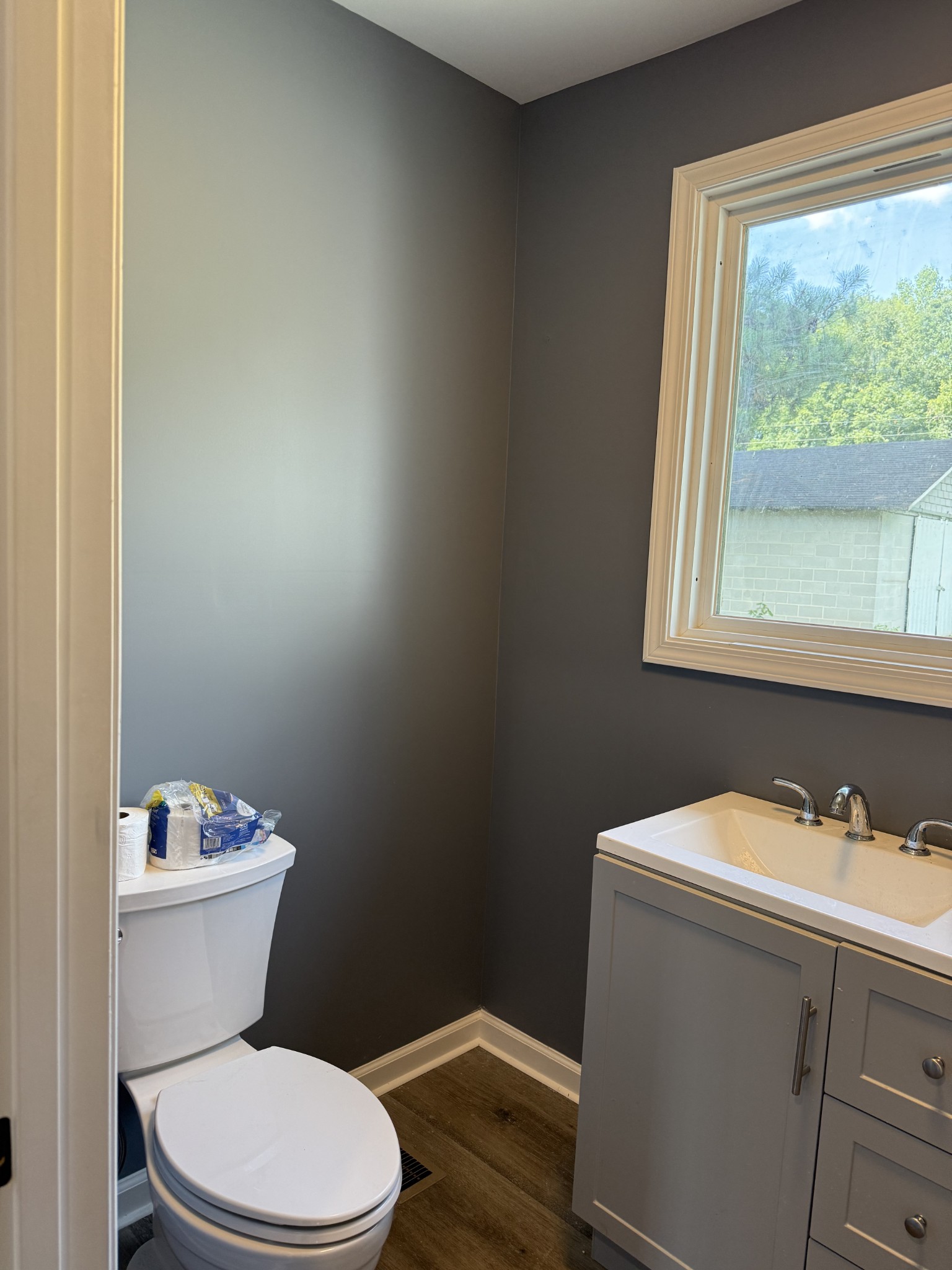 975 Witcher Hollow Road Red Boiling Springs, TN 37150 - Photo 12 of 28 a white toilet sitting next to a bathroom sink
