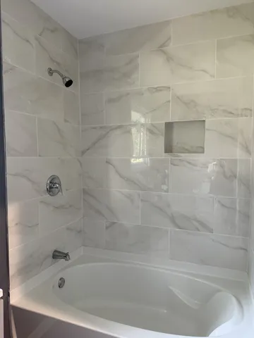 a close view of a bathtub in bathroom