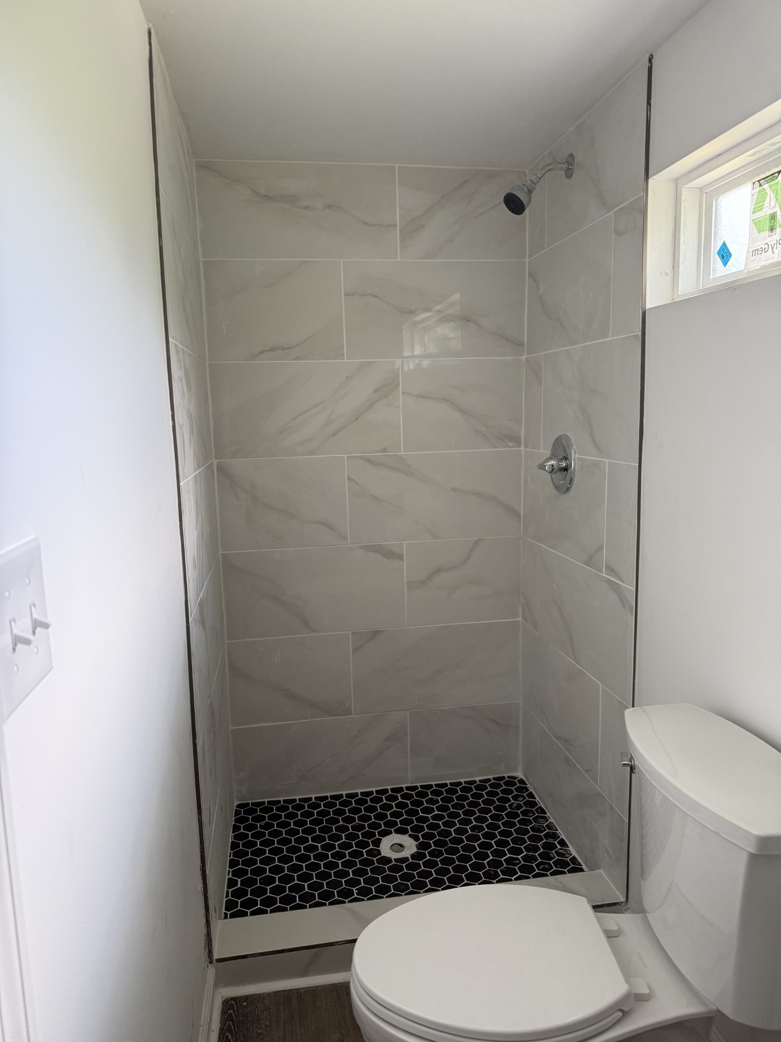 975 Witcher Hollow Road Red Boiling Springs, TN 37150 - Photo 18 of 28 a bathroom with a toilet and a shower