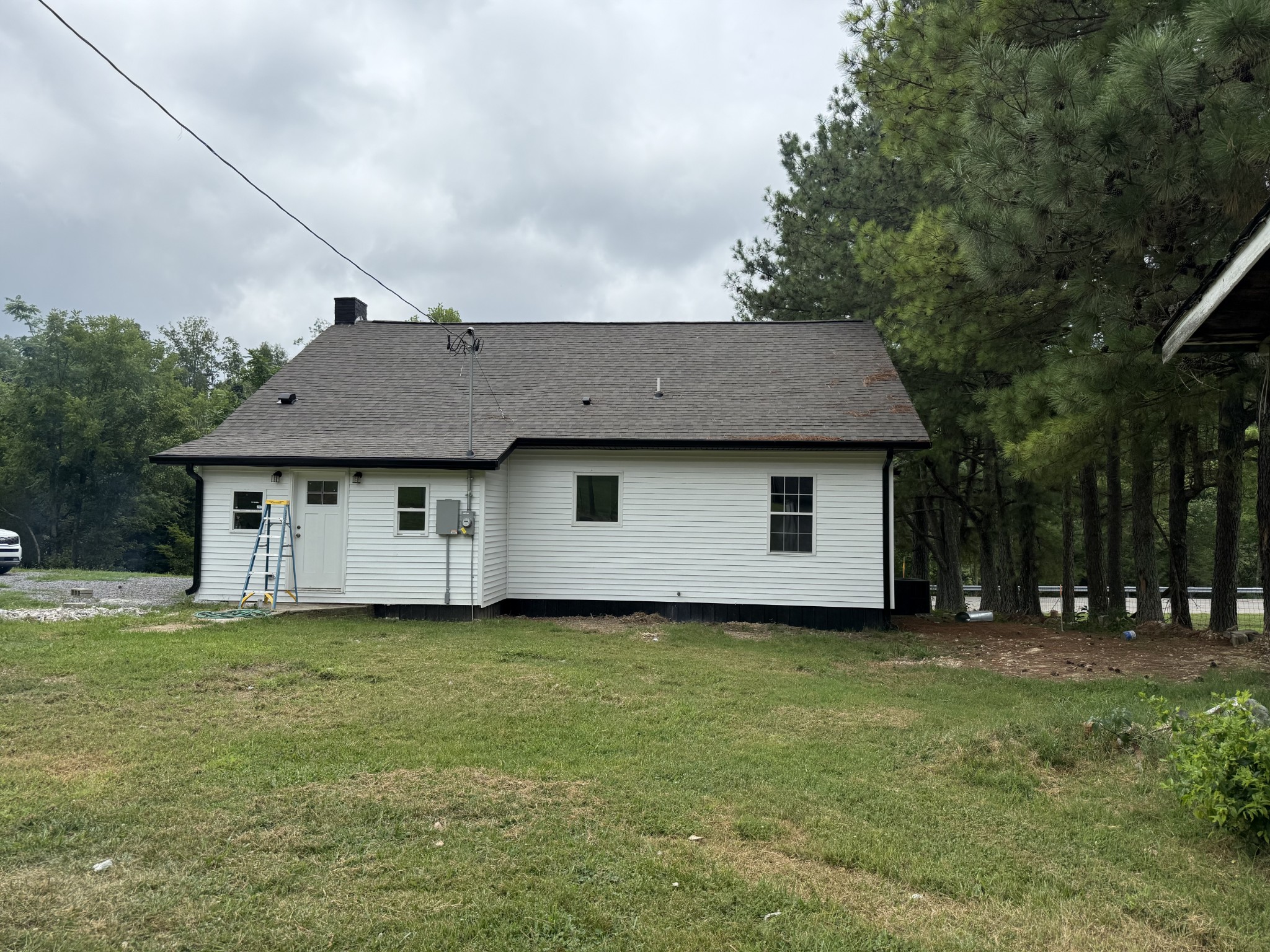 975 Witcher Hollow Road Red Boiling Springs, TN 37150 - Photo 24 of 28 a front view of house with yard and trees in the background