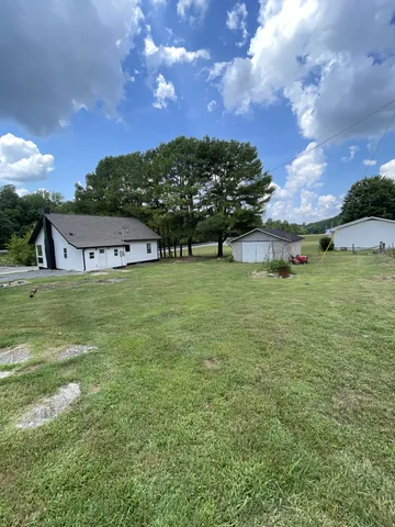 a view of a house with a big yard
