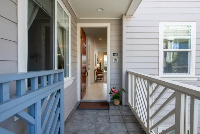 a front view of a building with a garden