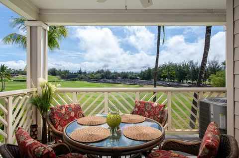 a view of a chairs and table in patio