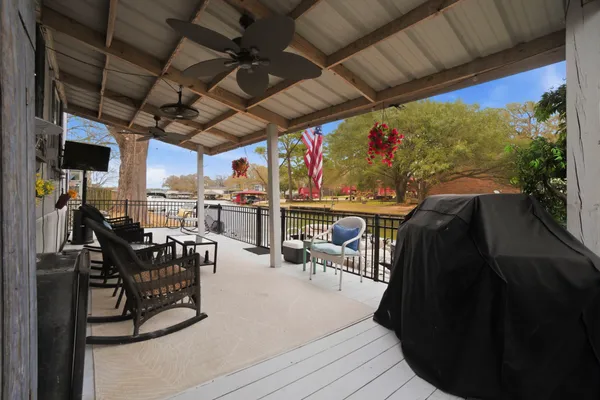 a view of a chairs and table in patio