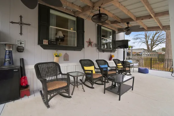 a work room with furniture and a flat screen tv