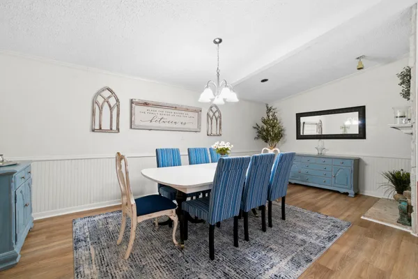 a view of a dining room with furniture