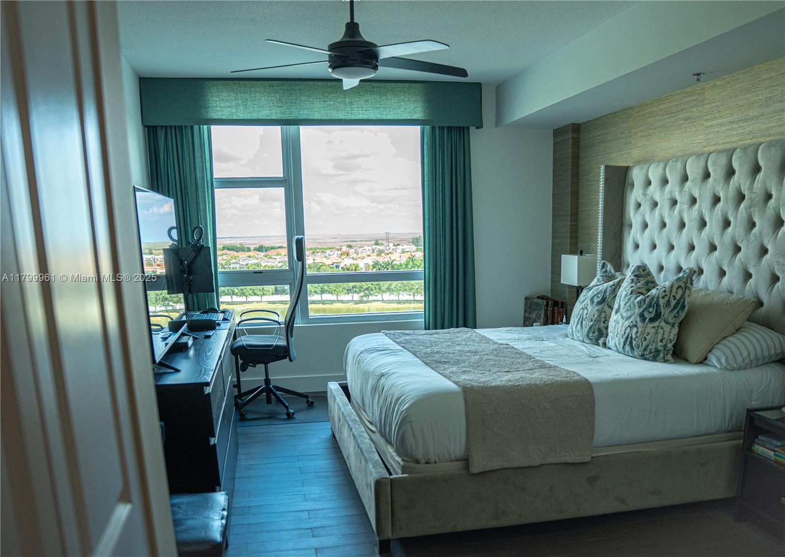 2681 North Flamingo Road, Unit 1206S Sunrise, FL 33323 - Photo 19 of 27 a bedroom with a bed and a window