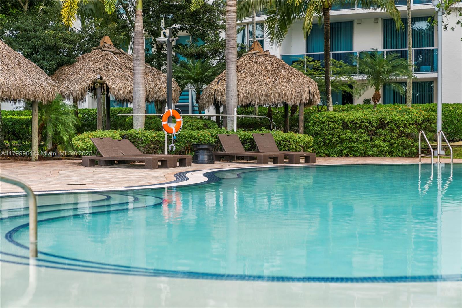 2681 North Flamingo Road, Unit 1206S Sunrise, FL 33323 - Photo 25 of 27 a view of a swimming pool with a patio and plants