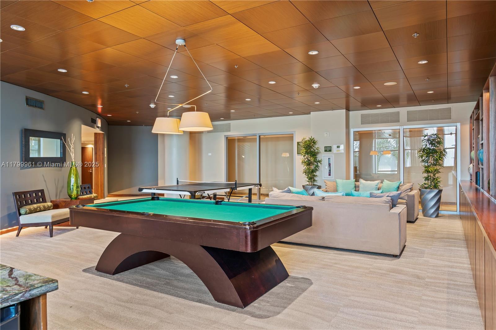 2681 North Flamingo Road, Unit 1206S Sunrise, FL 33323 - Photo 27 of 27 a living room with lots of furniture and a table