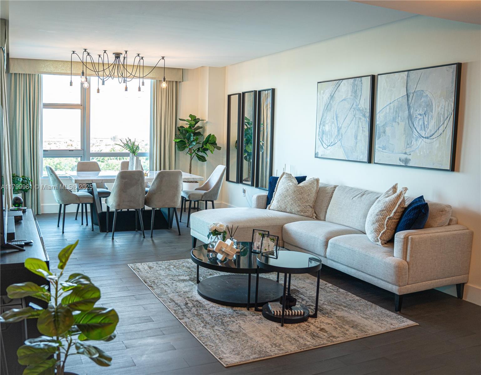 2681 North Flamingo Road, Unit 1206S Sunrise, FL 33323 - Photo 4 of 27 a living room with furniture and a large window