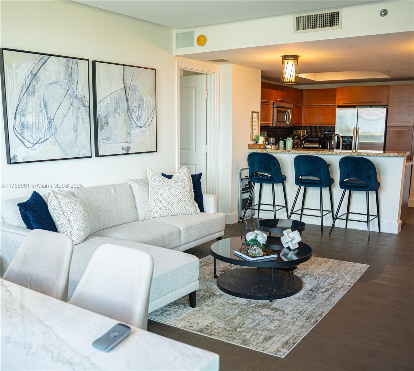 2681 North Flamingo Road, Unit 1206S Sunrise, FL 33323 - Photo 10 of 27 a living room with furniture potted plant and a fireplace