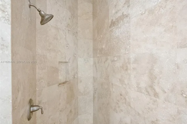 a bathroom with a bathtub sink and mirror