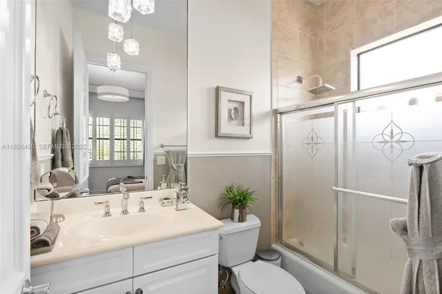 a bedroom with a large bed and a wooden floor