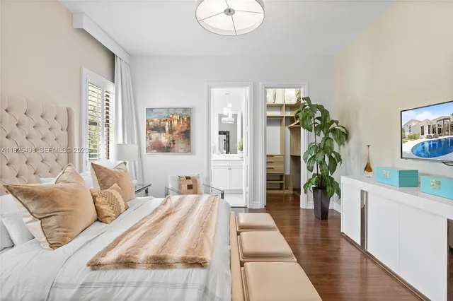 a bedroom with bed and a window