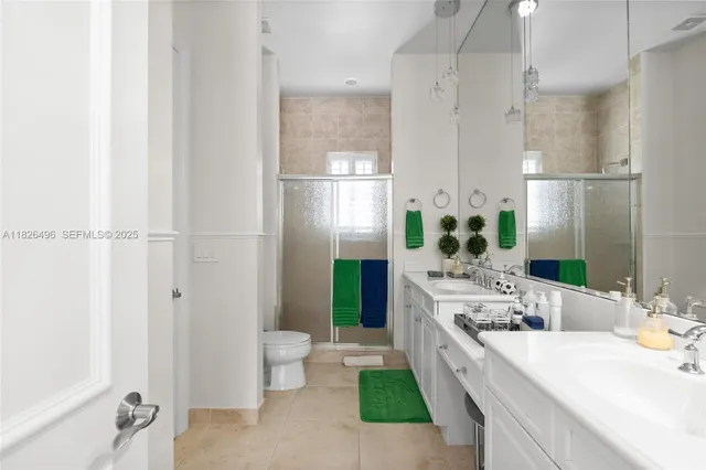 a view of a patio with table and chairs with wooden floor and plants