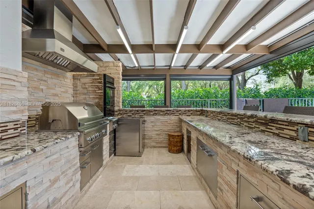 a stove top oven sitting inside of a kitchen