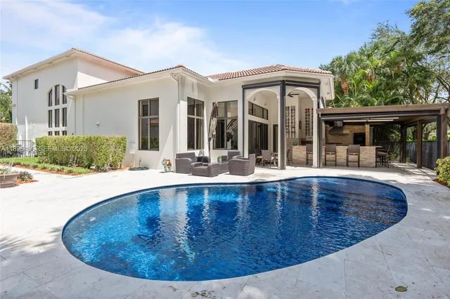 a view of a backyard with sitting area