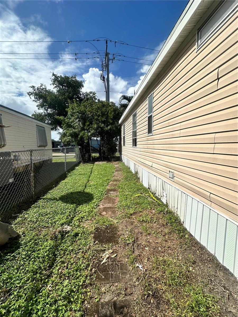 22844 Tradewind Road, Unit H Boca Raton, FL 33428 - Photo 15 of 16 a view of a backyard with pathway