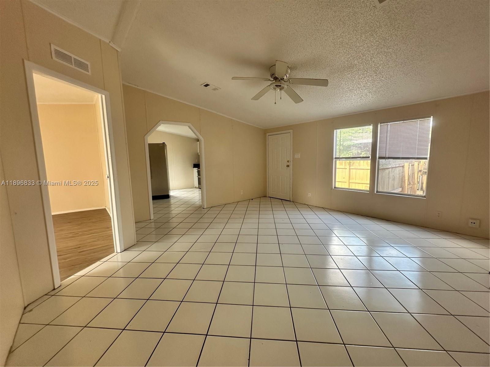 22844 Tradewind Road, Unit H Boca Raton, FL 33428 - Photo 2 of 16 a view of an empty room and window