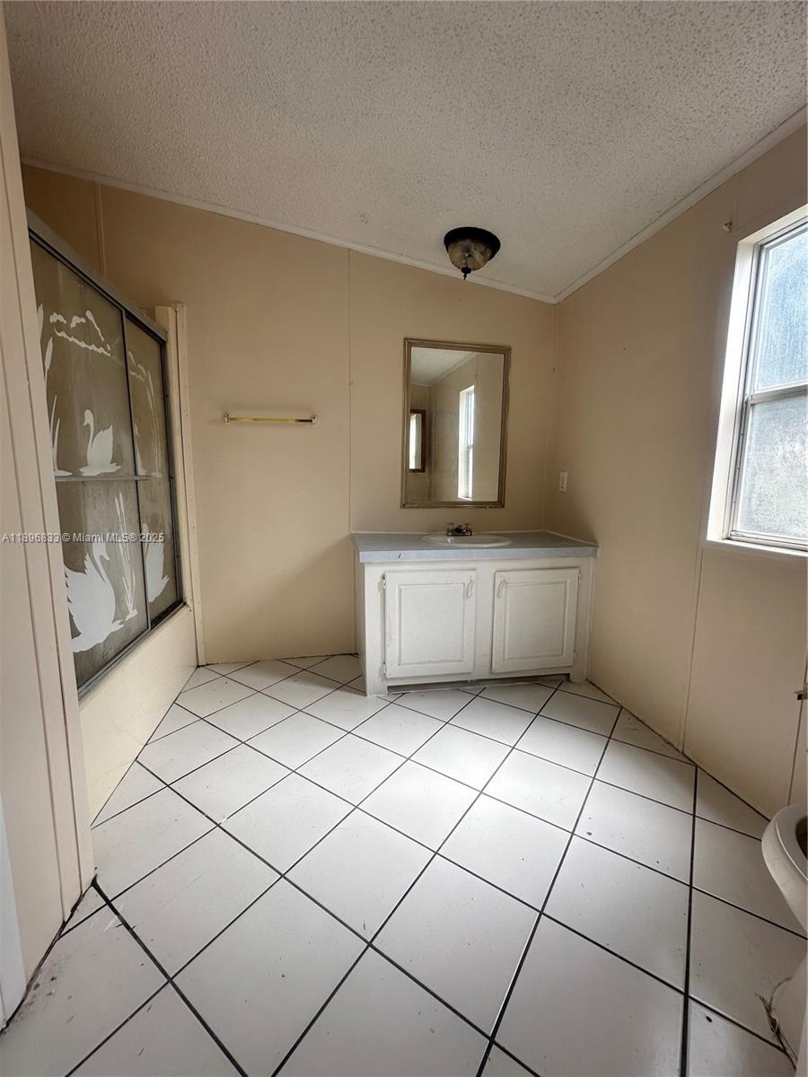 22844 Tradewind Road, Unit H Boca Raton, FL 33428 - Photo 8 of 16 a view of a utility room and window