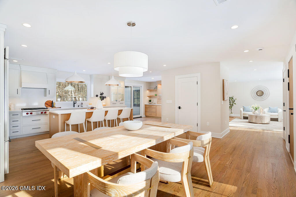 49 Salisbury Road Darien, CT 06820 - Photo 6 of 40 a view of a dining room with furniture and wooden floor