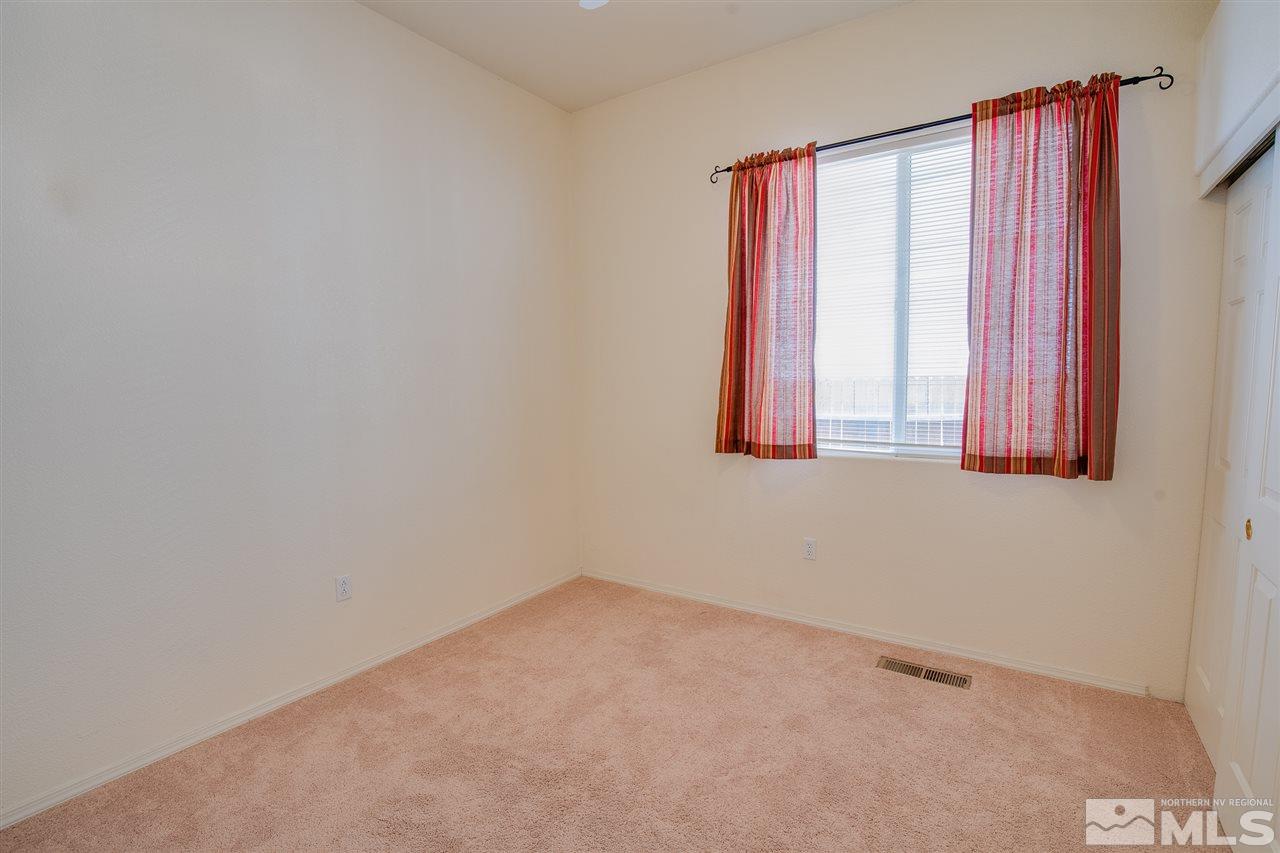 1735 Legacy Village Road Reno, NV 89521 - Photo 16 of 23 a view of an empty room with a window