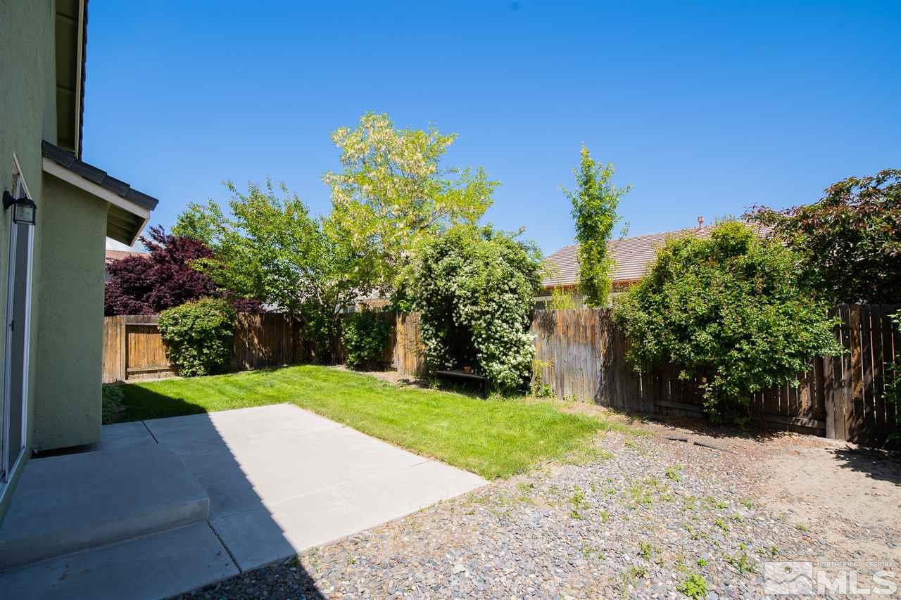 1735 Legacy Village Road Reno, NV 89521 - Photo 23 of 23 a view of a yard with flower plants