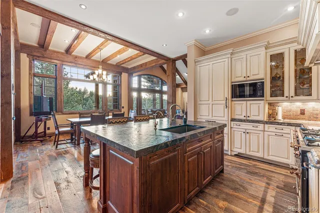 a kitchen with granite countertop lots of counter top space and stainless steel appliances
