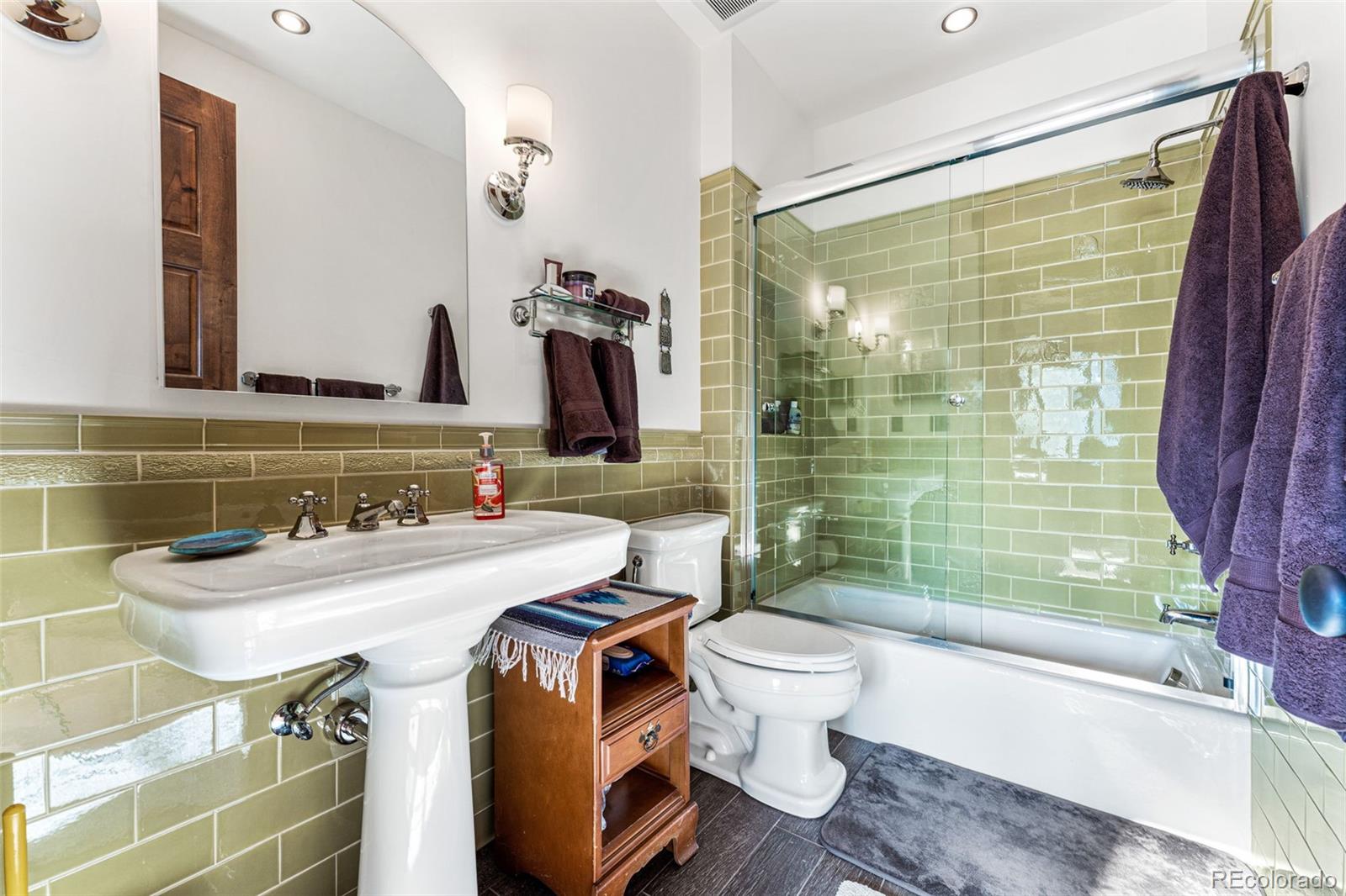 30 West Ranch Trail Morrison, CO 80465 - Photo 31 of 50 a bathroom with a sink toilet and shower