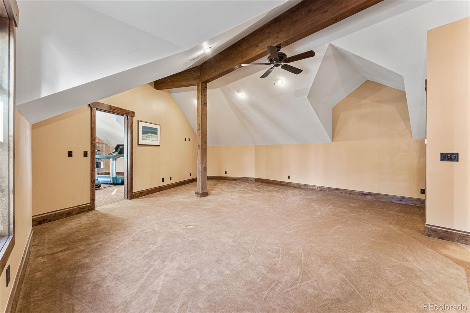 30 West Ranch Trail Morrison, CO 80465 - Photo 35 of 50 a view of an empty room with wooden floor and a window