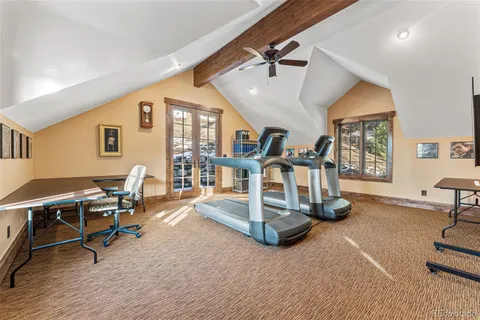 a view of a livingroom with furniture and a floor to ceiling window