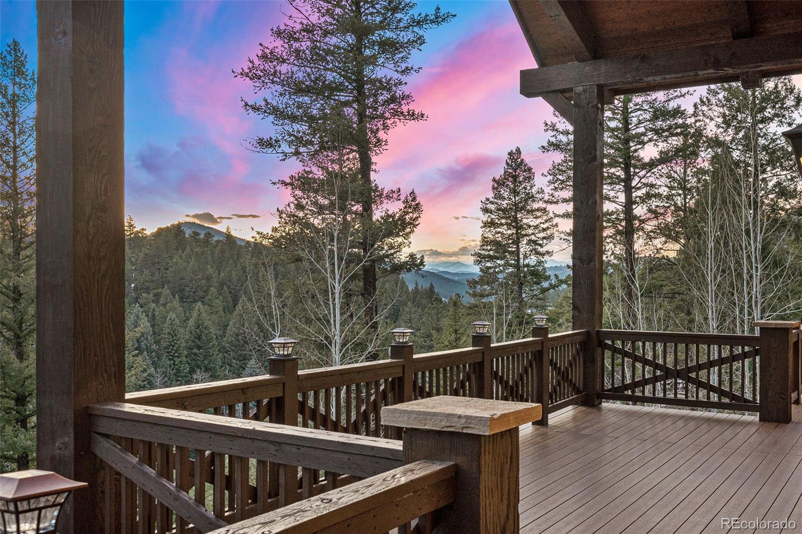 30 West Ranch Trail Morrison, CO 80465 - Photo 39 of 50 a view of balcony with wooden floor and outdoor seating