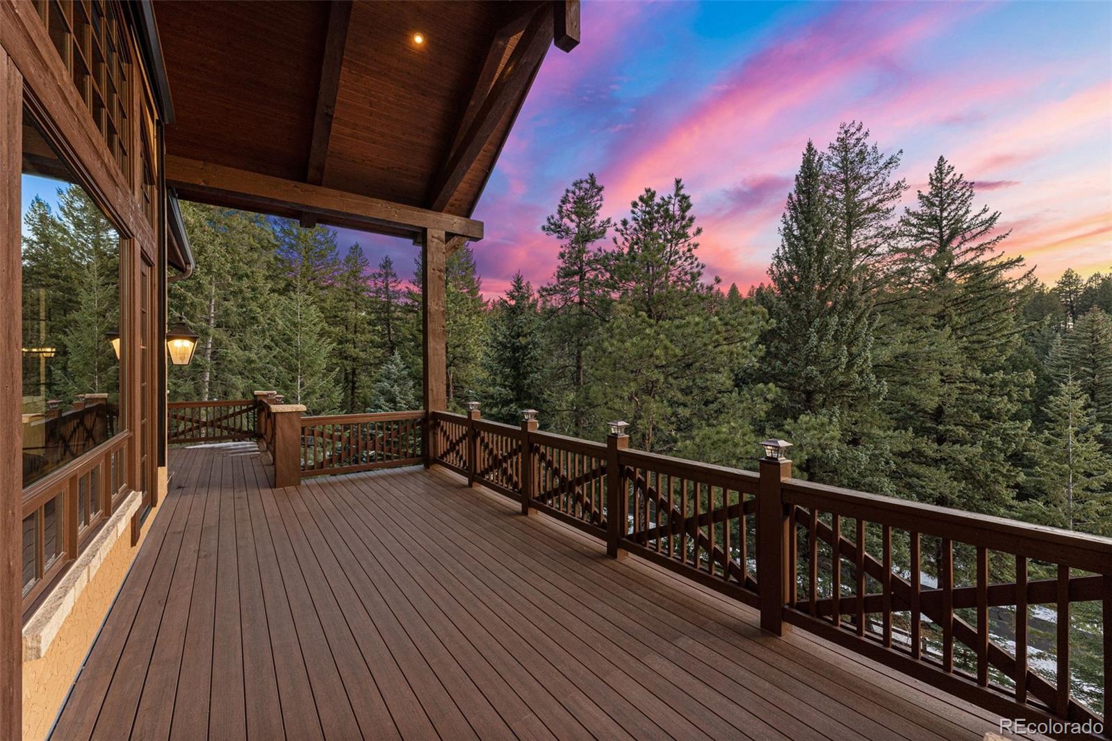 30 West Ranch Trail Morrison, CO 80465 - Photo 41 of 50 a view of balcony with wooden floor and outdoor seating