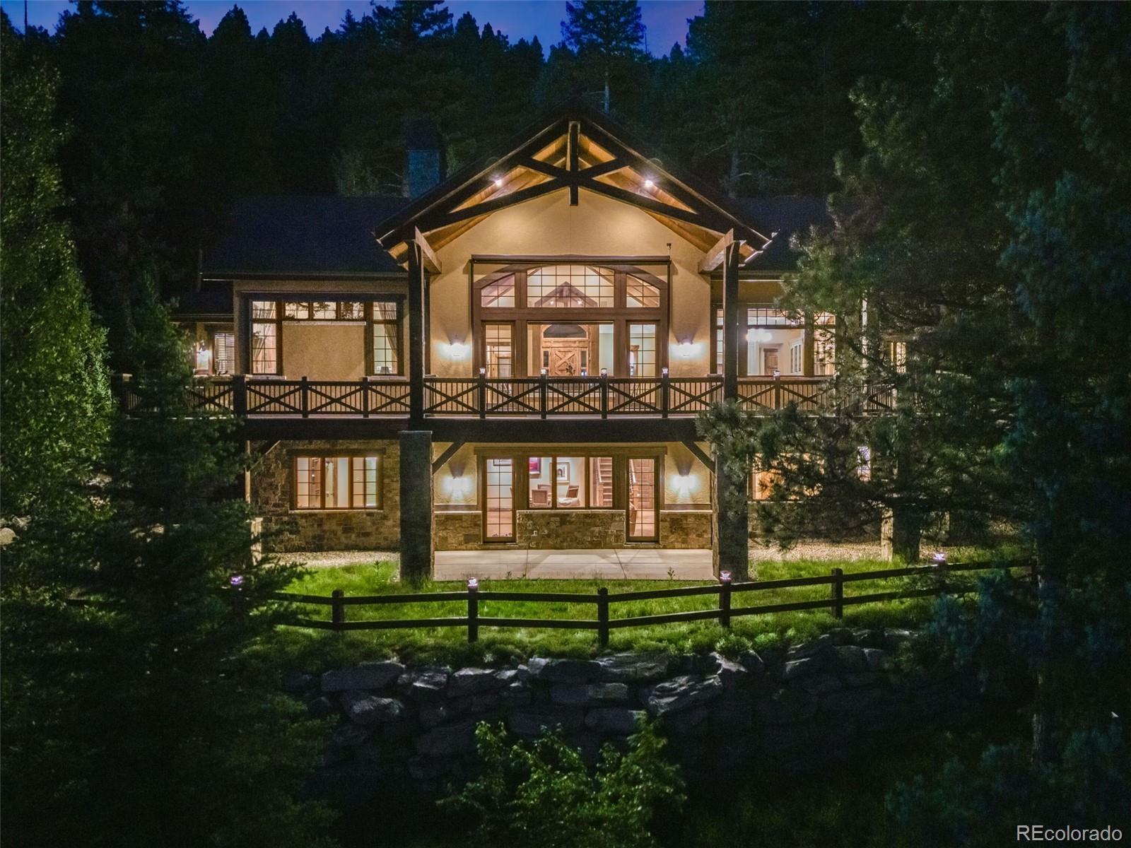 30 West Ranch Trail Morrison, CO 80465 - Photo 47 of 50 a front view of a house with a yard