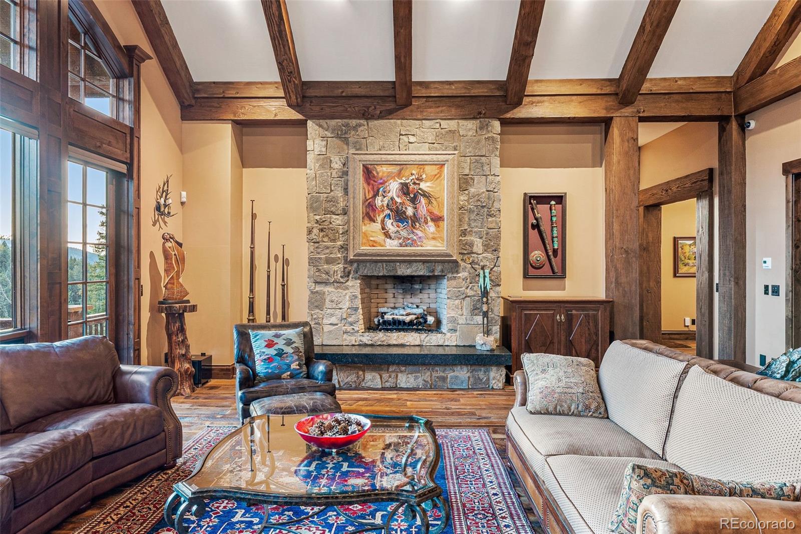 30 West Ranch Trail Morrison, CO 80465 - Photo 7 of 50 a living room with furniture and a fireplace